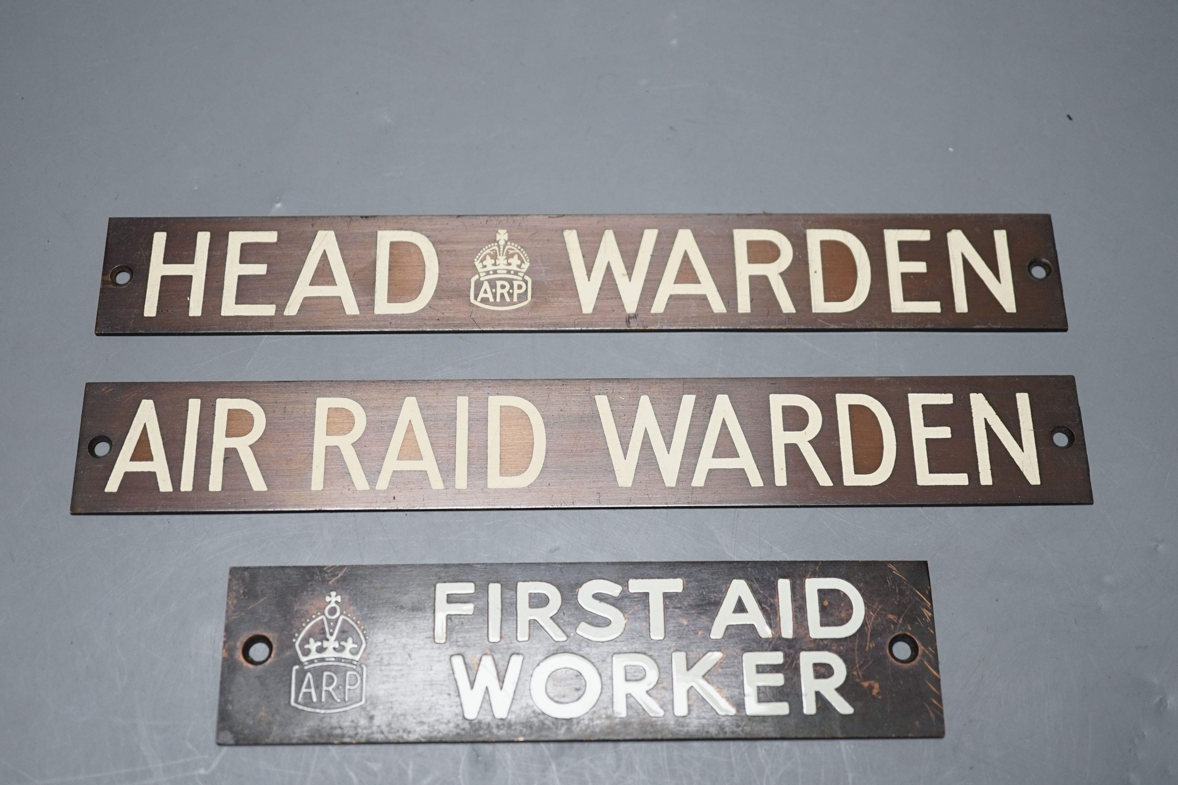 Three Air Raid Precautions signs together with a ‘Thunderbird’ sign. (4) largest 3 x 23cm
